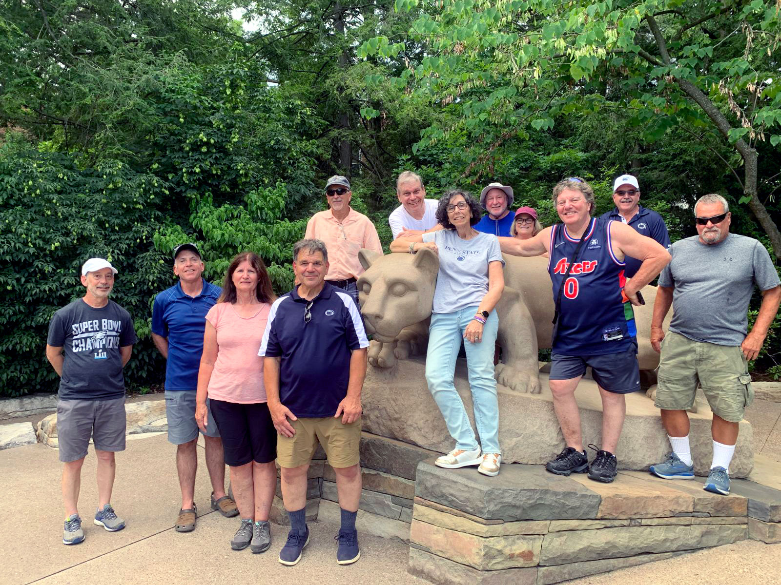 group of former Nittany Hall dorm mates in front of Nittany Lion Shrine, courtesy