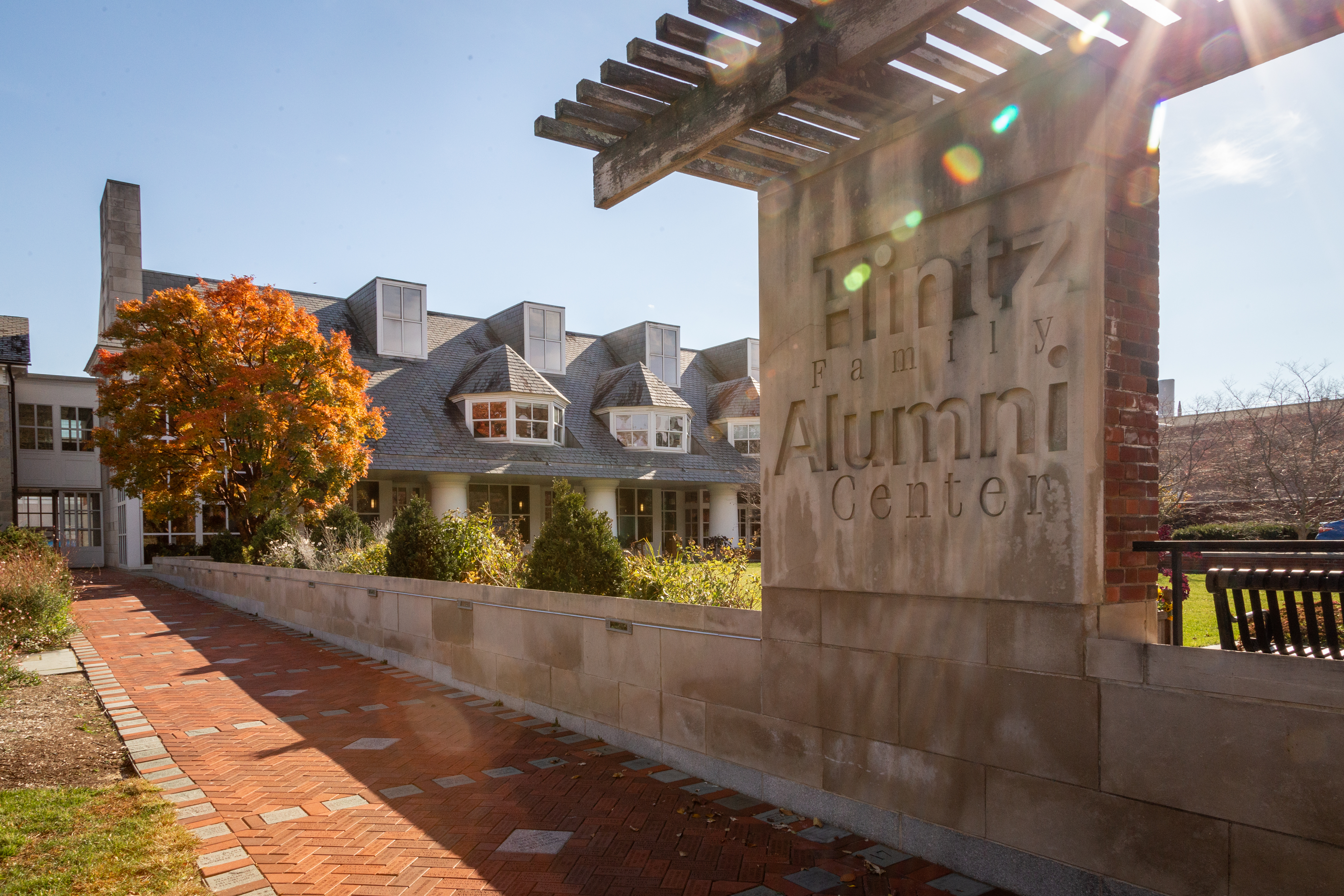 exterior photo of stone Hintz Family Alumni Center entrance by Nick Sloff '92 A&A