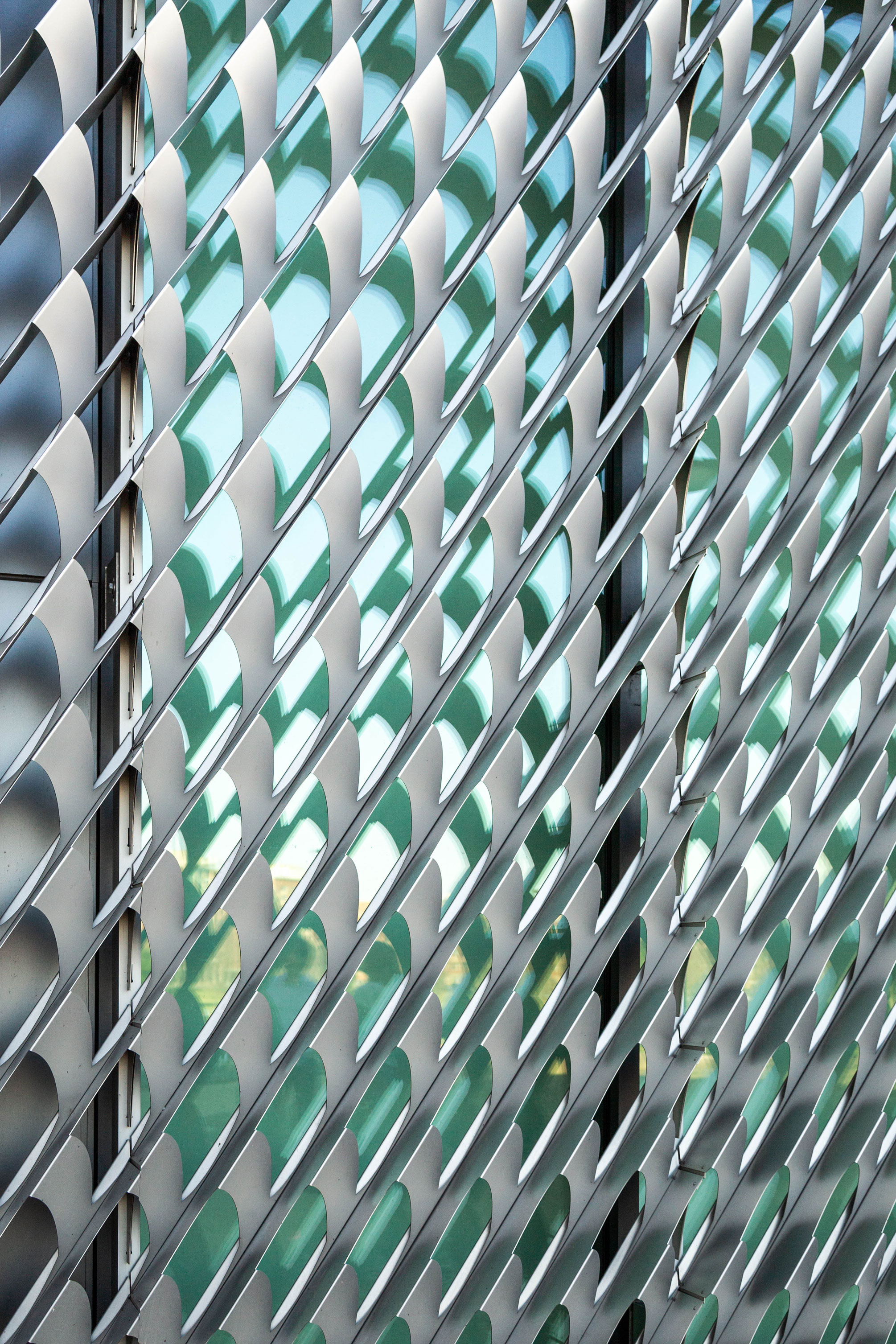 closeup of perforated stainless steel lens filtering light into museum, photo by Nick Sloff '92 A&A