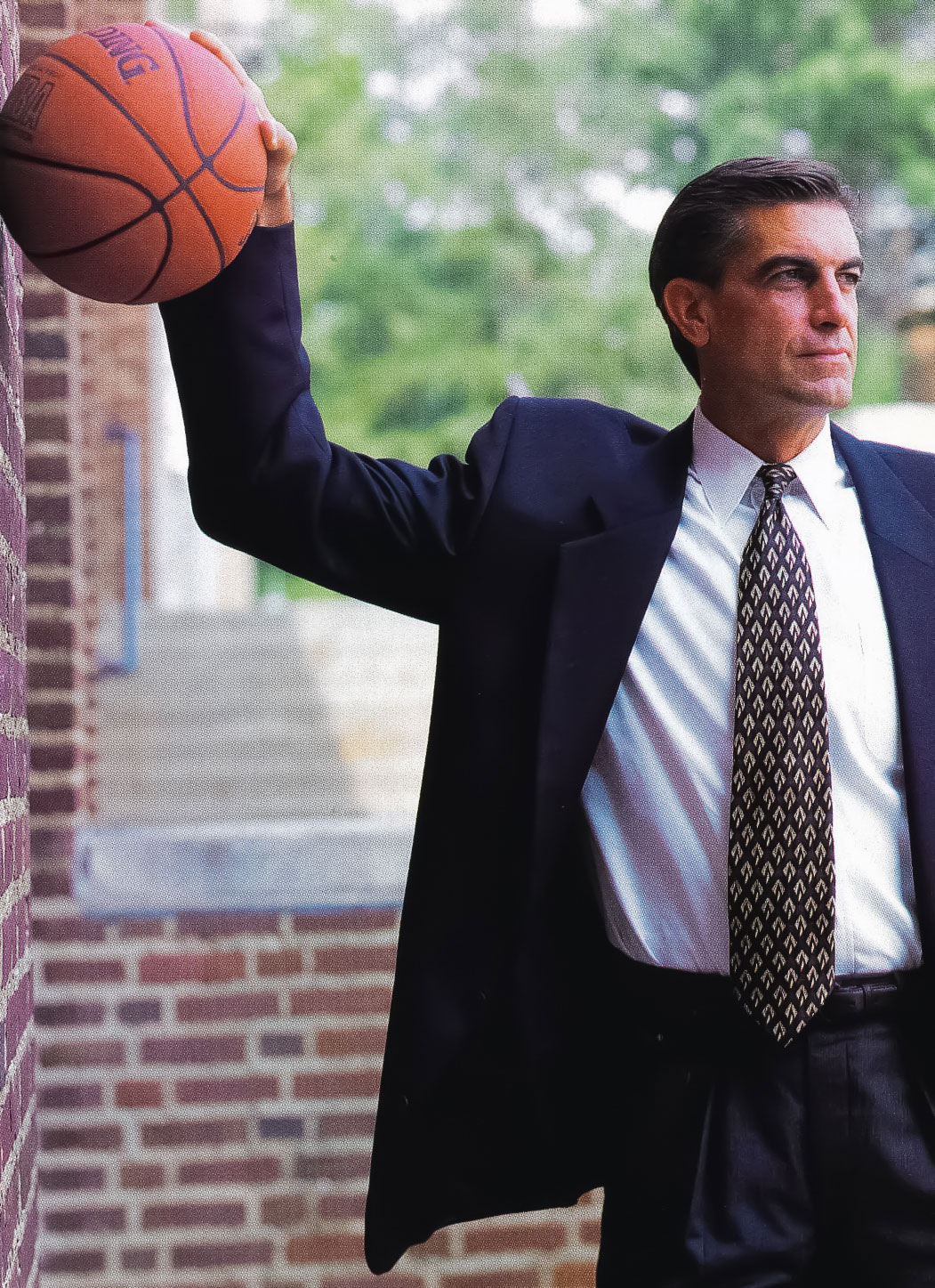 Bruce Parkhill holding a basketball against a wall by Dan Oleski '87 A&A