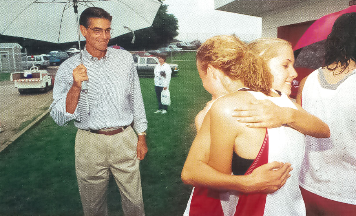 Parkhill watching his daughter Katie embrace a teammate, photo by Dan Oleski '87 A&A