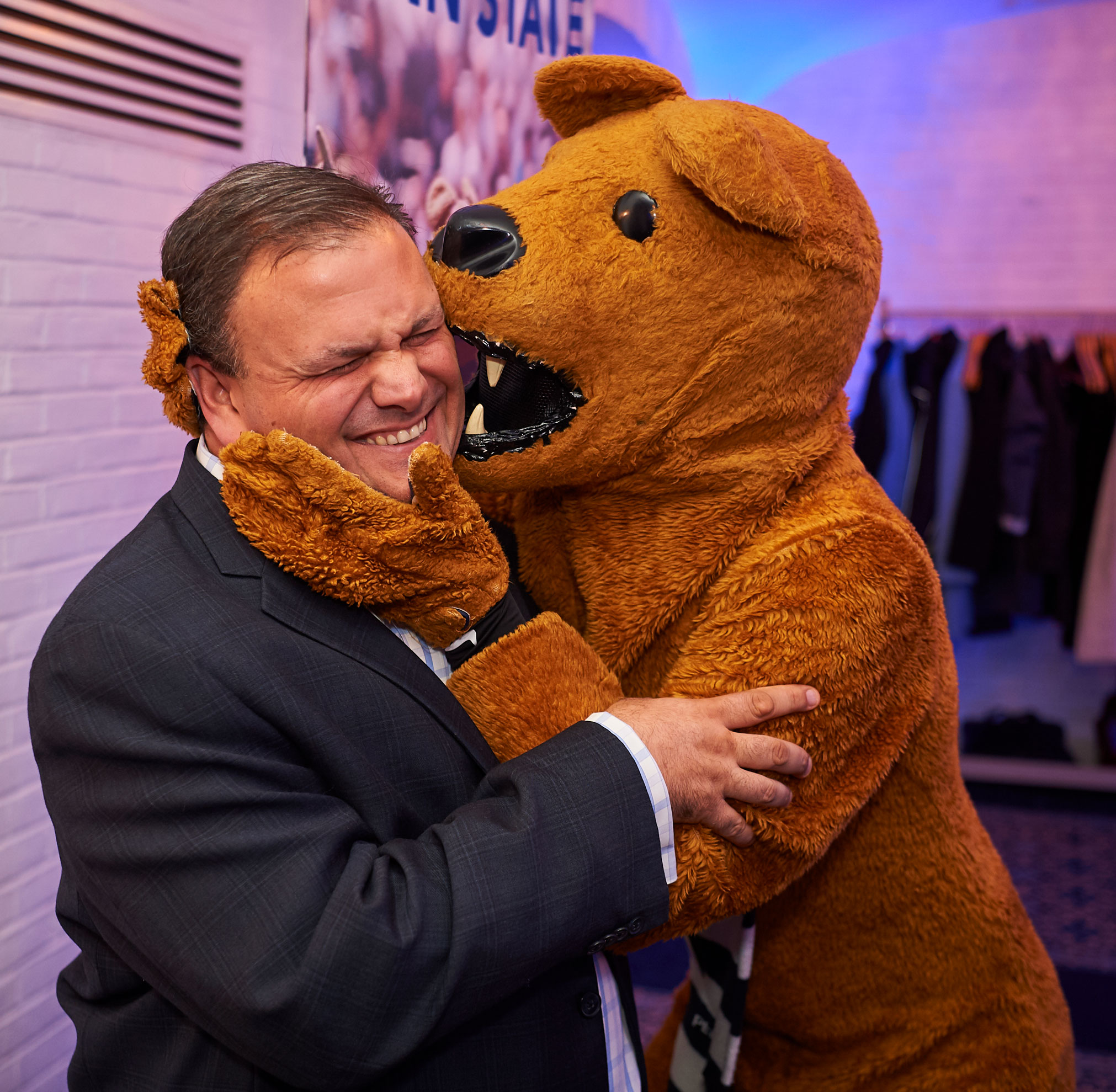 Nittany Lion embracing CEO Paul Clifford, photo by Penn State Alumni Association