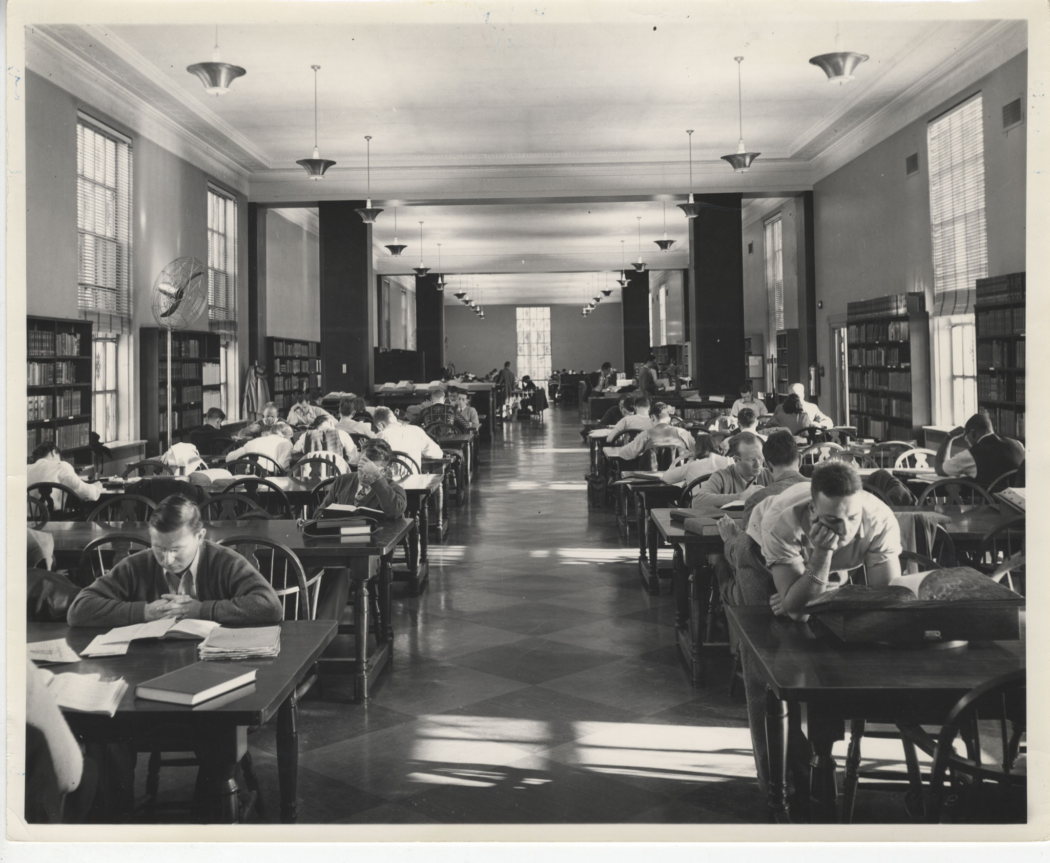 black and white photo of the library Reading Room by Penn State Libraries.