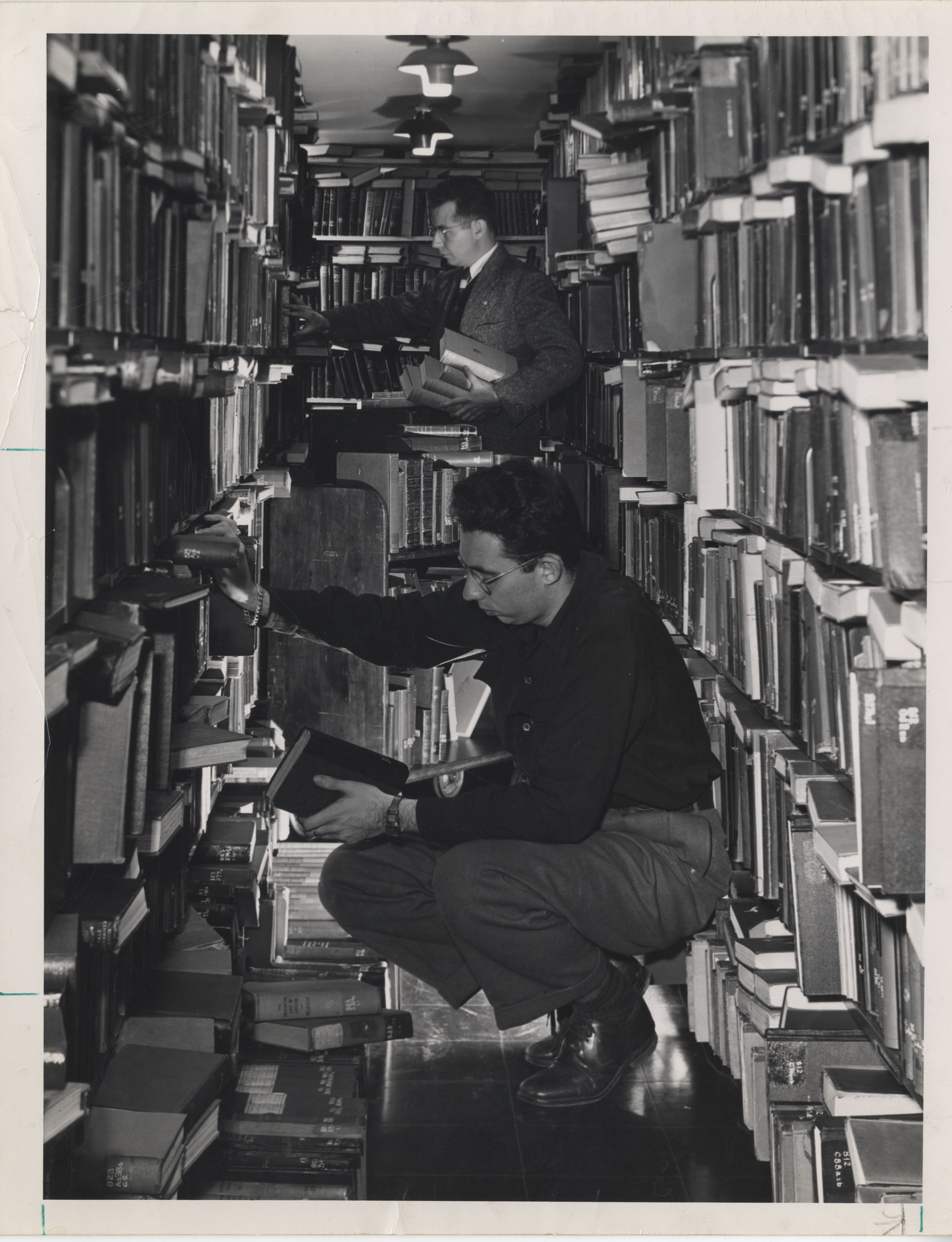 photo of people browsing in the stacks by Penn State Libraries