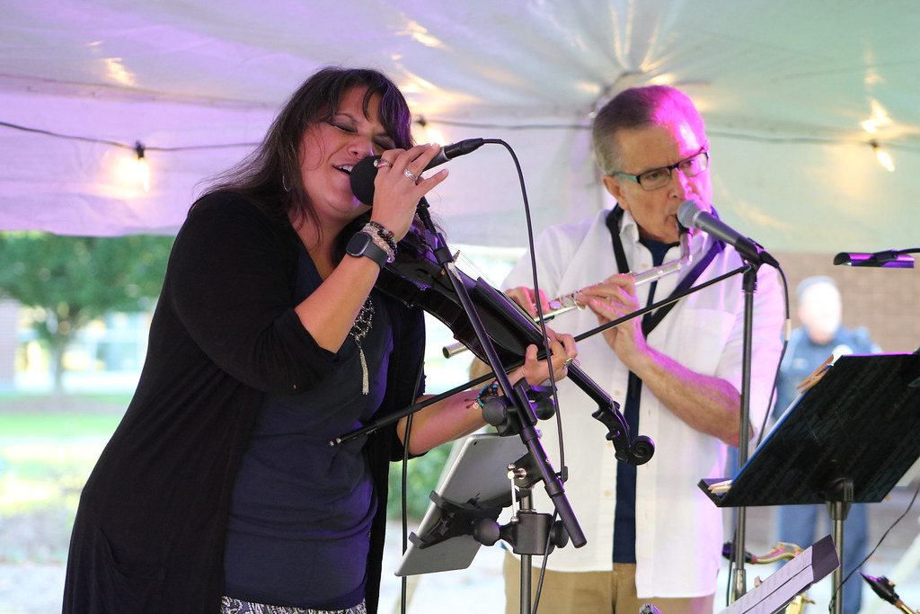 photo of a man and woman performing music, courtesy