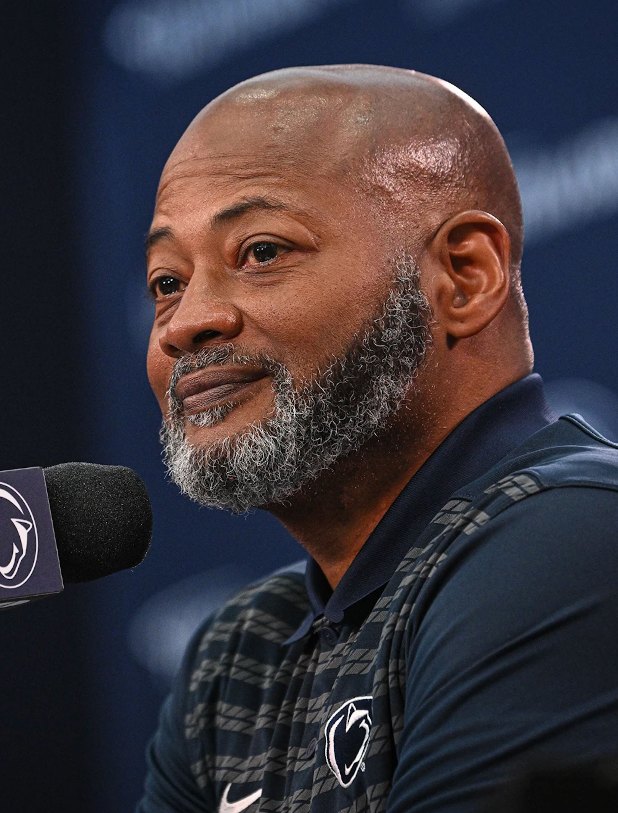 Terry Smith speaking into a microphone, photo by Mark Selders/Penn State Athletics