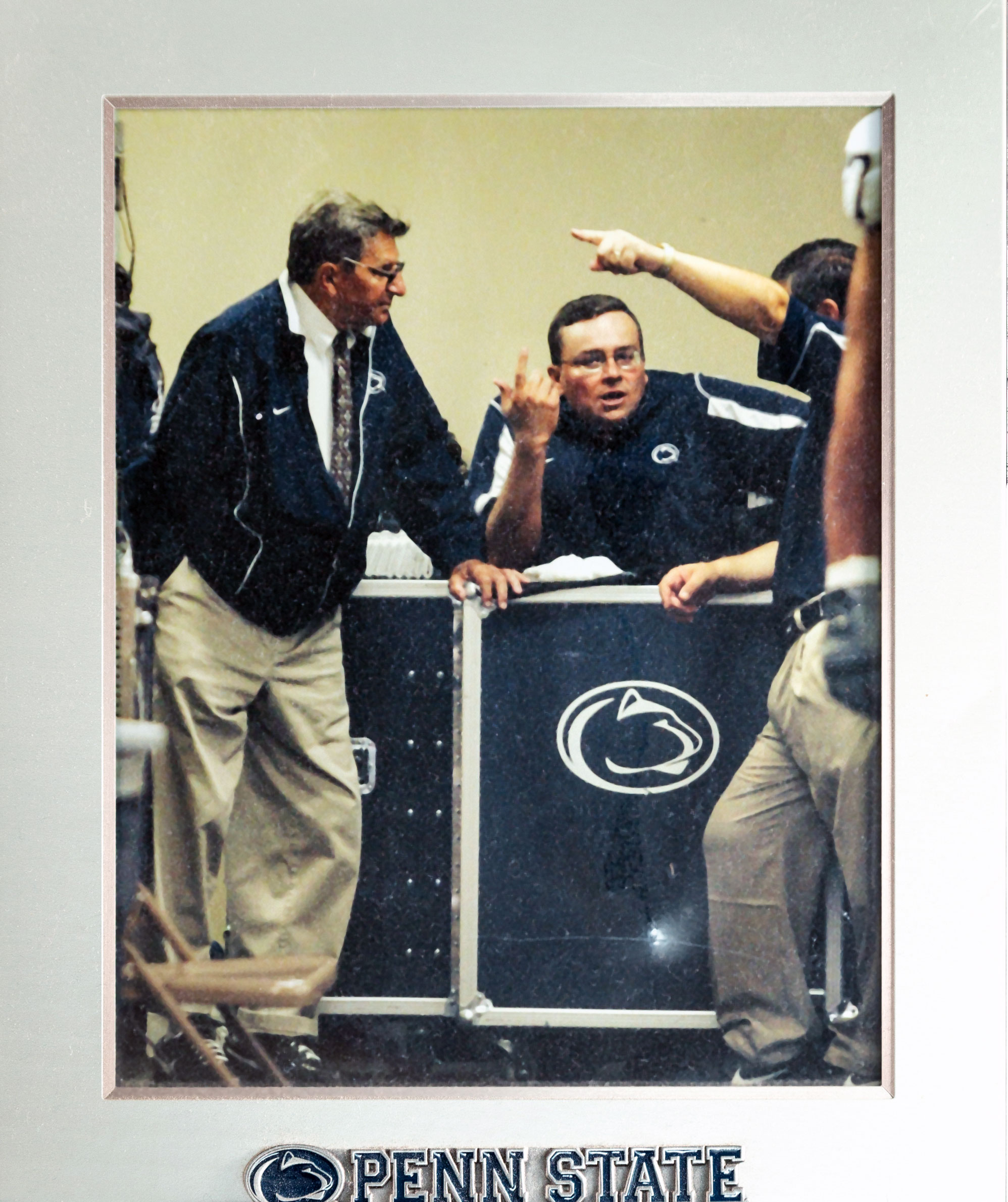 photo of a framed picture of Caldwell and Paterno by Nick Sloff '92 A&A