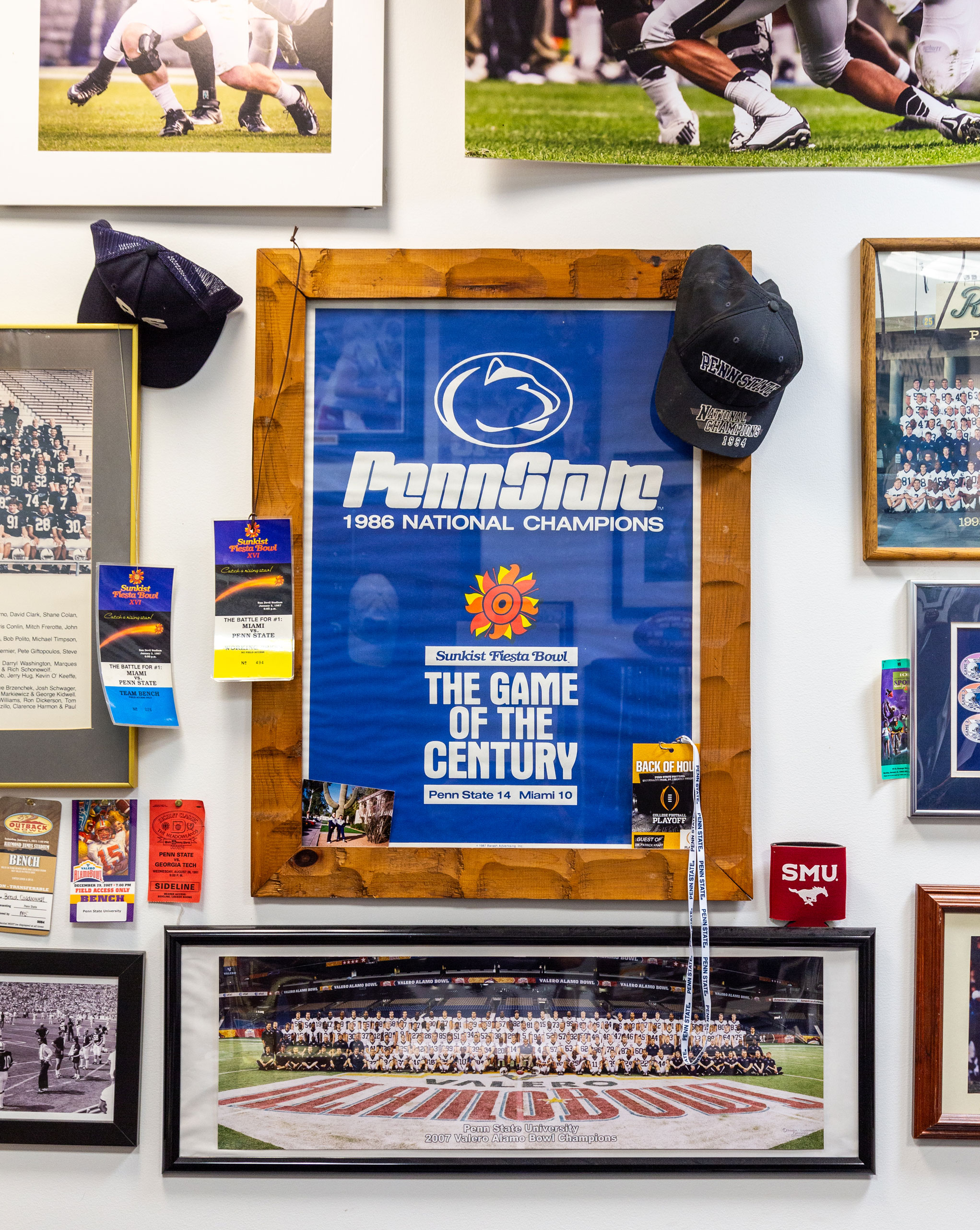 photo of a group of framed photos on Caldwell's office wall from various Penn State bowl game appearances by Nick Sloff '92 A&A