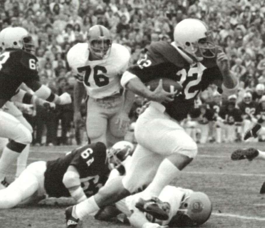 black and white photo of Suhey carrying the ball for Penn State, by Getty Images