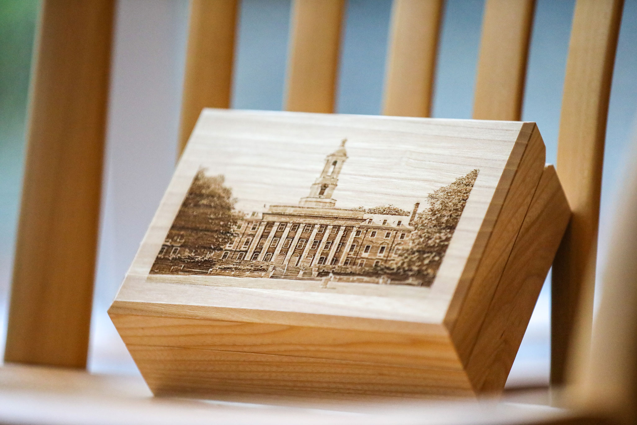 photo of a wooden box with Old Main image on front from Elms Collection by Penn State Alumni Association