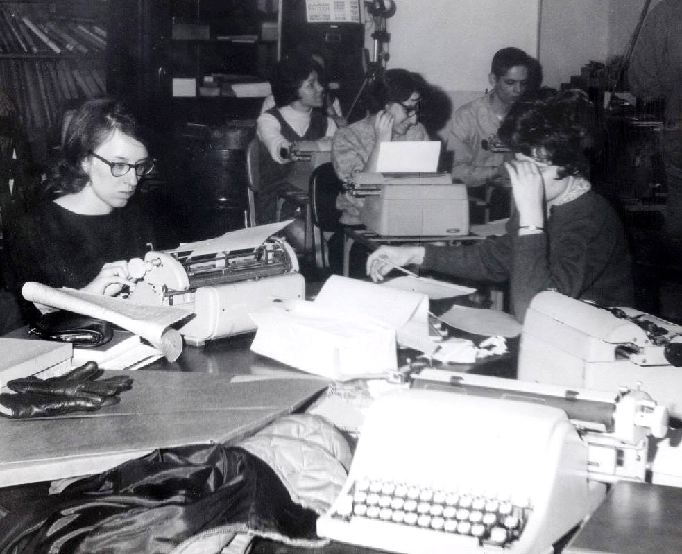 black and white photo of Collegian staffers in office by Penn State Archives