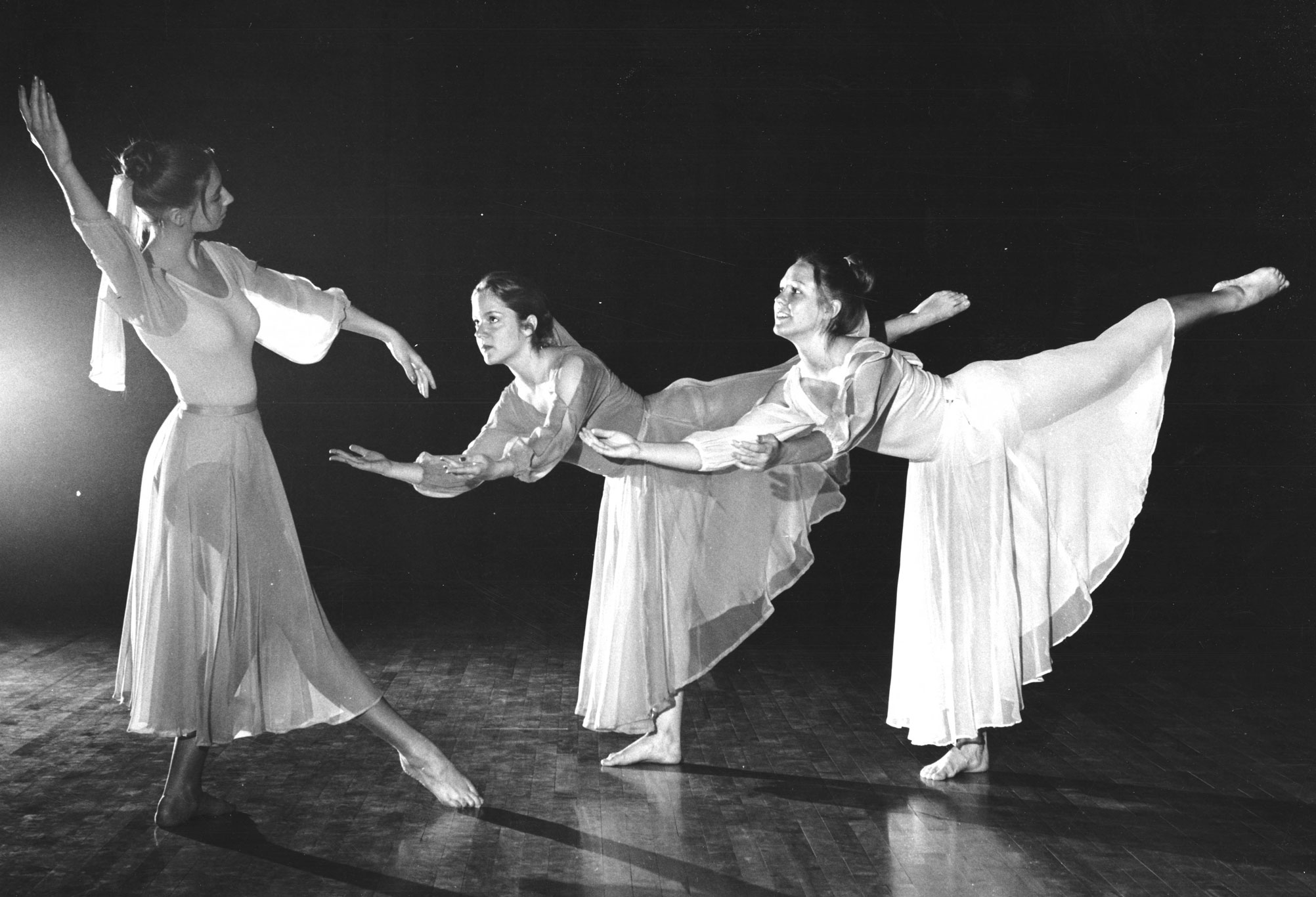 black and white photo of three dancers on stage by Penn State Archives
