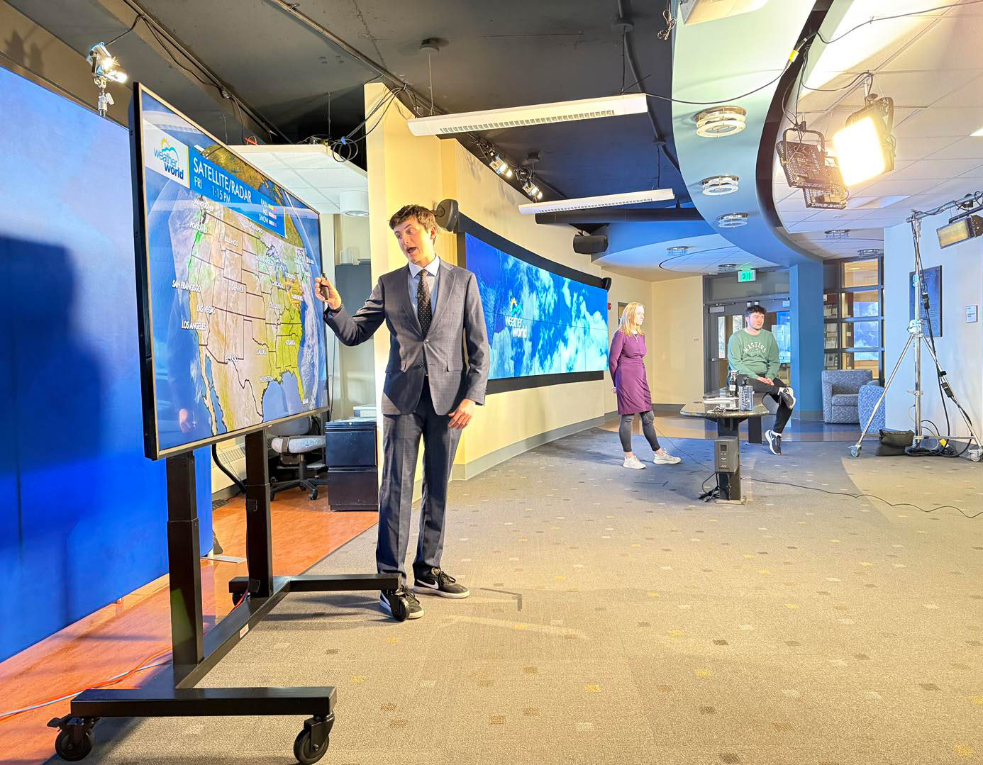 photo of a student in the campus weather service studio by Weather World