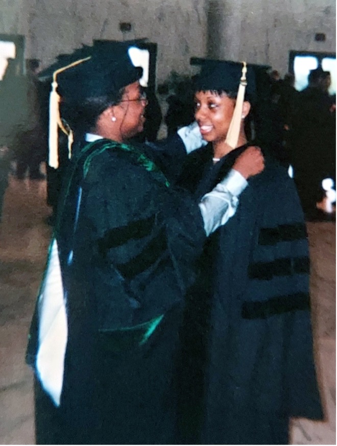 Elana McDonald and Delana Wardlaw in graduation caps and gowns, courtesy