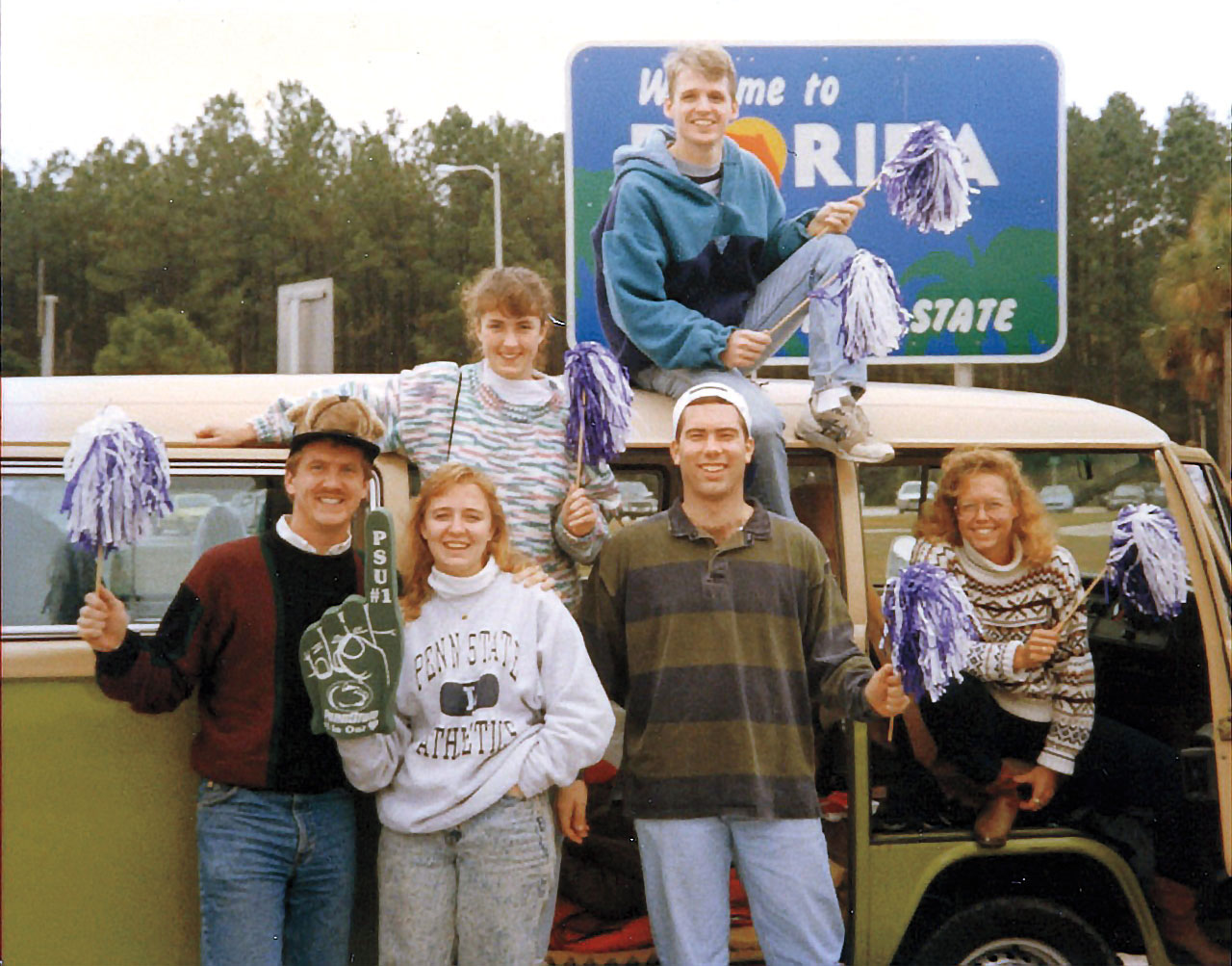 group of people in front of VW bus