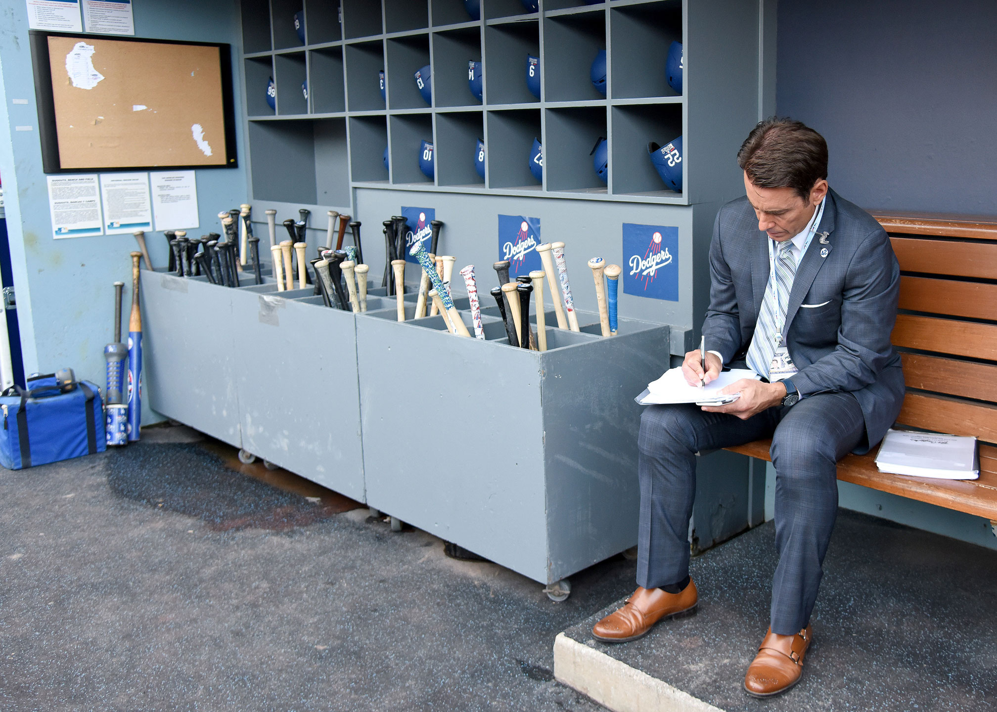 Verducci in Dodgers locker room sitting on a bench taking notes by Fox Media LLC
