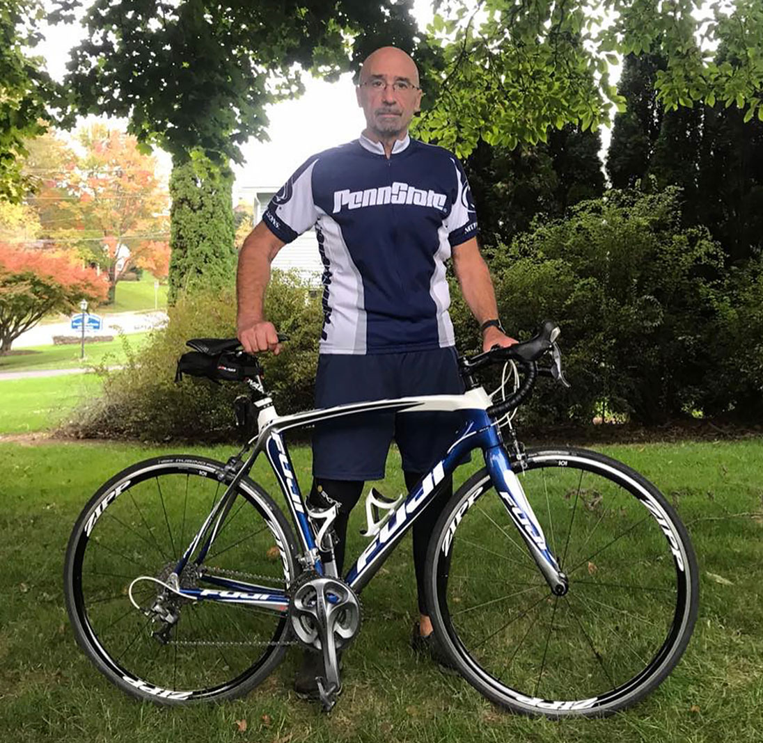 photo of Weiss outdoors with his bike, courtesy