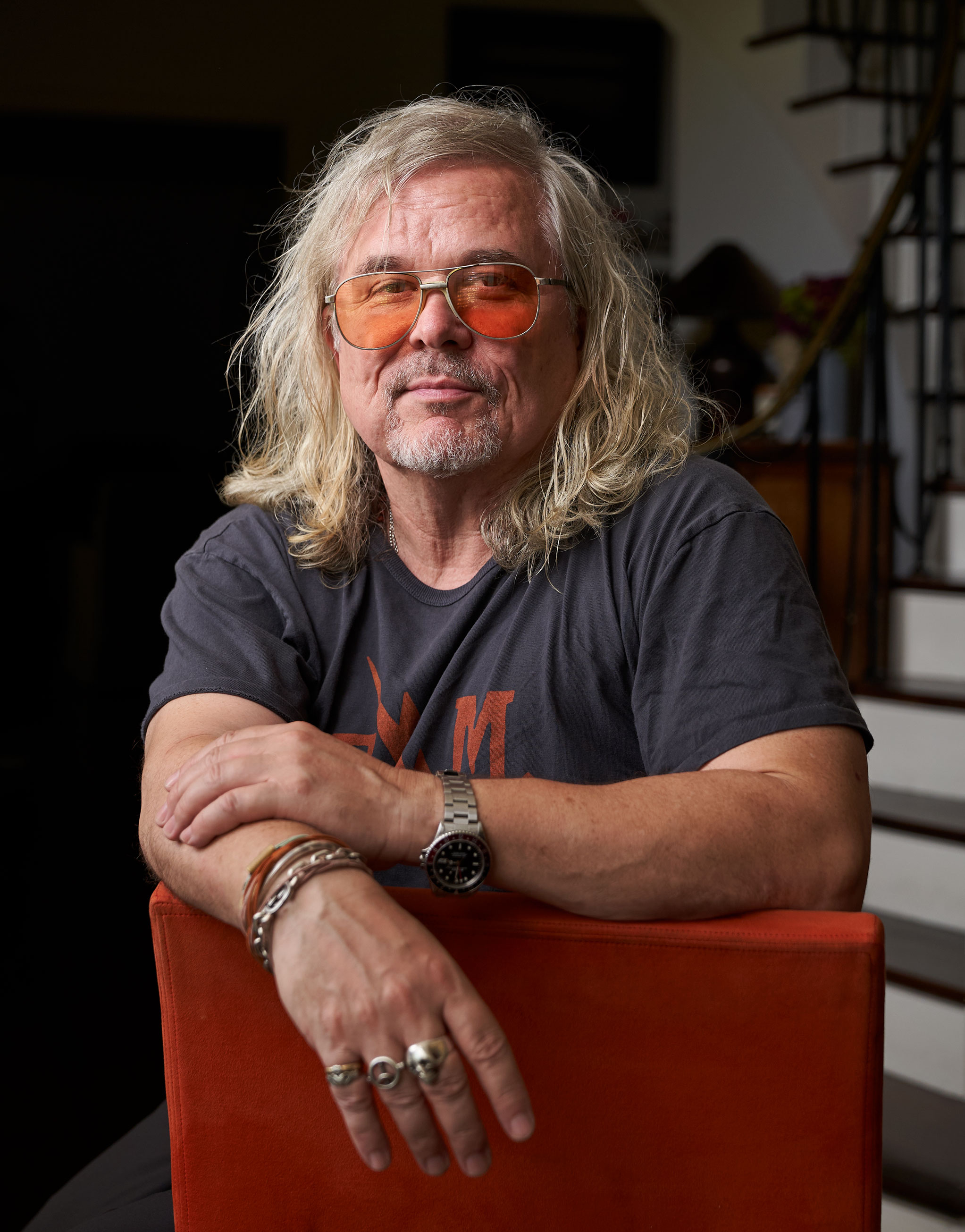 photo of Andrew Kevin Walker sitting backwards on a chair by Gregg Segal