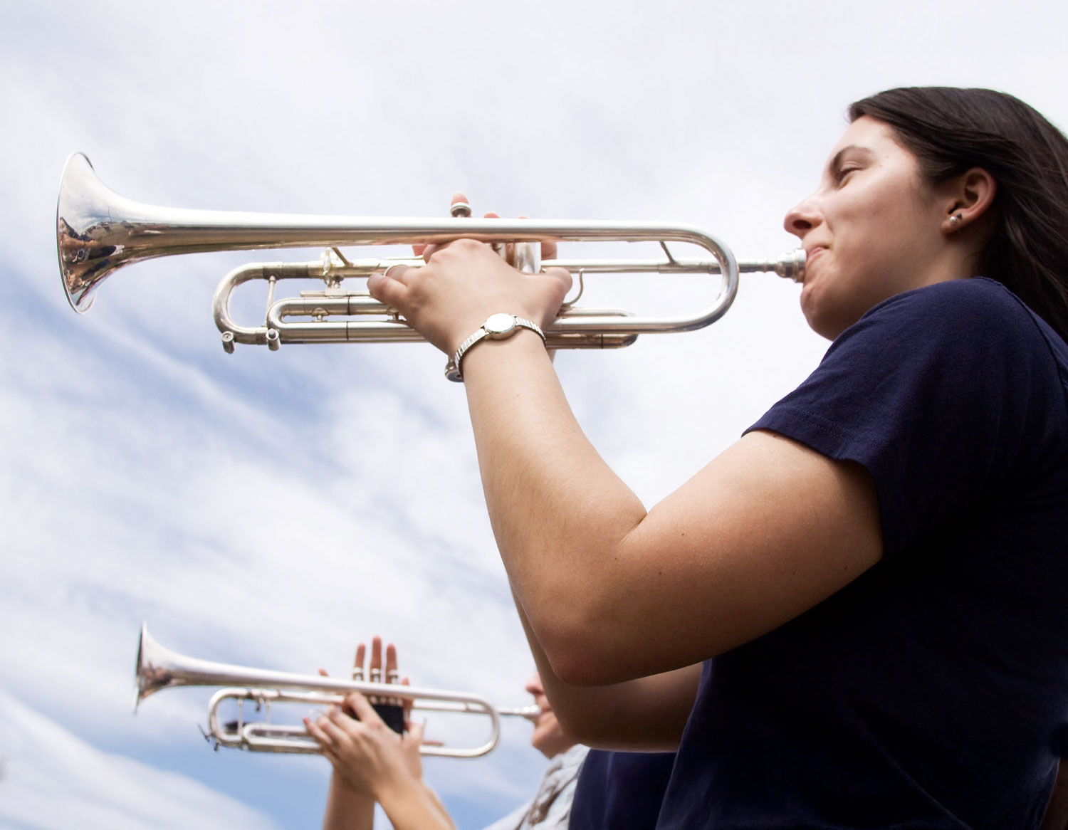 closeup of two trombone players by Nick Sloff '92 A&A