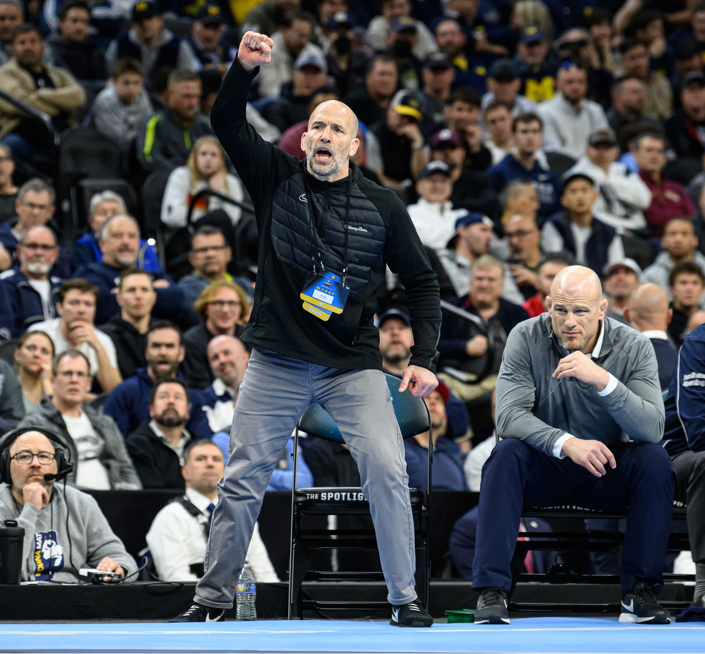 Cunningham standing with raised fist beside Sanderson, photo by Mark Selders/Penn State Athletics
