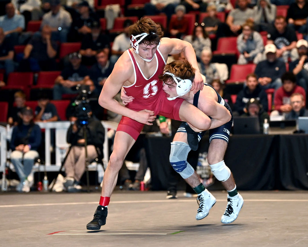 Penn State wrestler taking down a Stanford wrestler in a December 2025 meet, photo by Mark Selders/Penn State Athletics