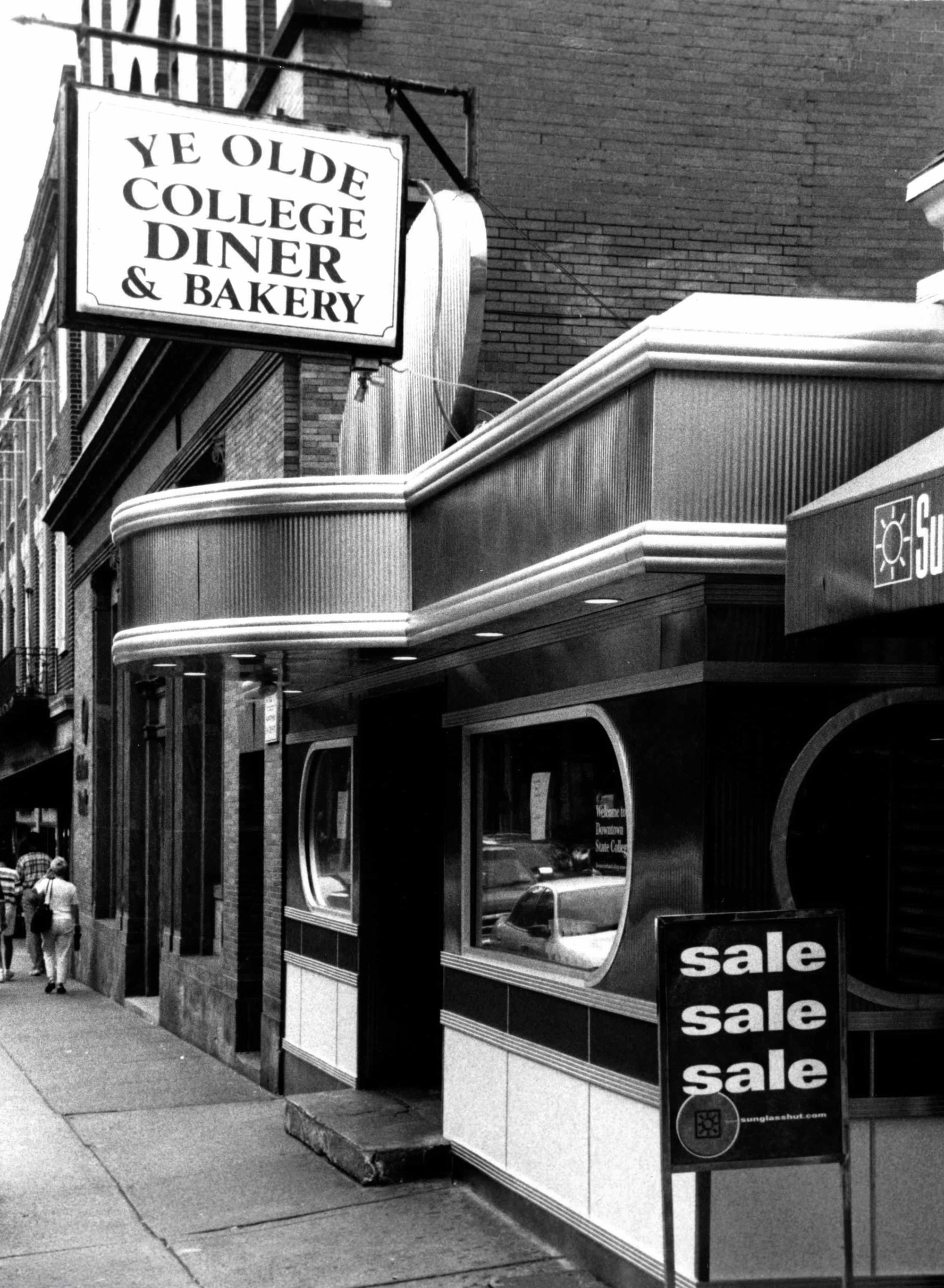 black and white photo of exterior of Ye Olde College Diner