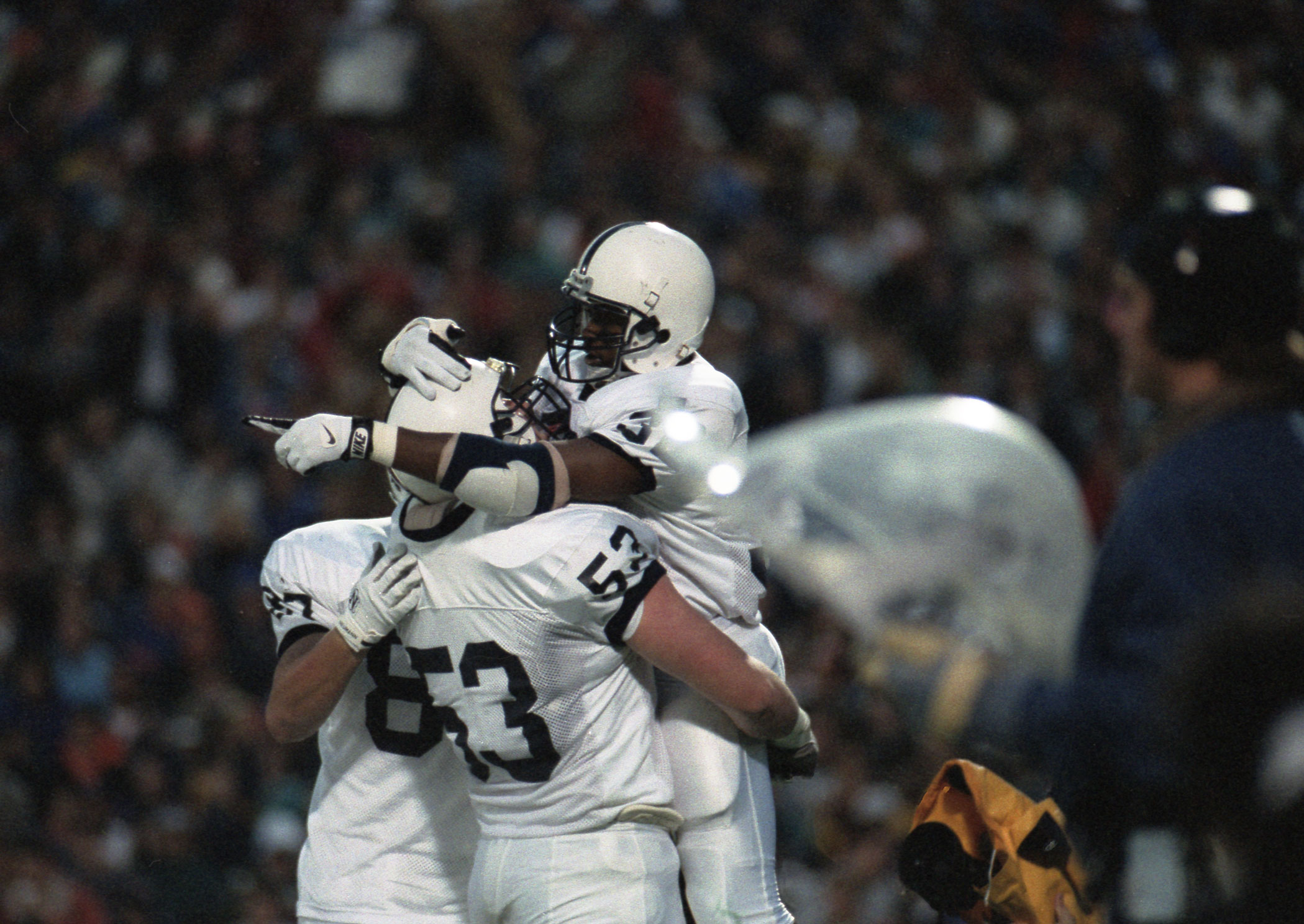 Carter celebrates with teammates after third quarter TD, photo by Curt Beamer / Blue White Illustrated
