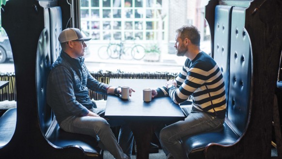 Business partners sitting in booth