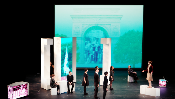 performers on stage sitting and standing on various white columns in front of a blue-green screen with natural setting, by Roman Iwasiwka
