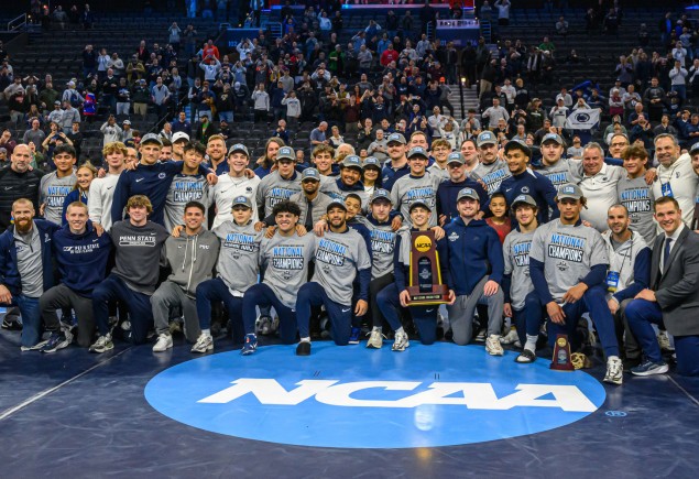 group shot of Penn State wrestling team after setting another NCAA championship record, by Mark Selders/Penn State Athletics