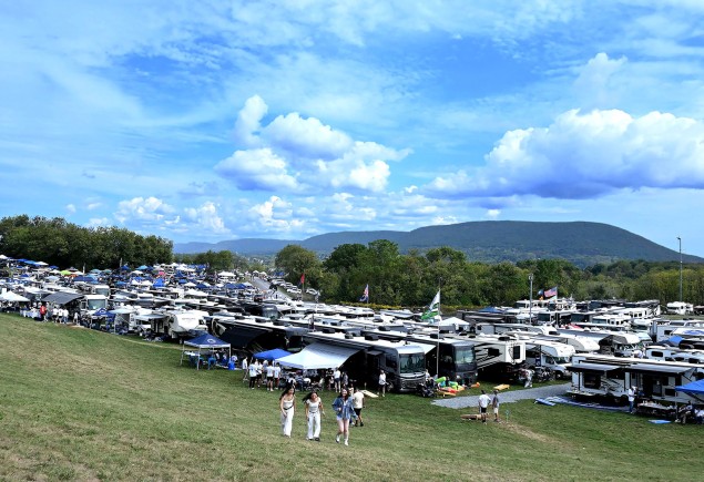 wide shot of tailgaters against backdrop of Mount Nittany by Penn State Alumni Association