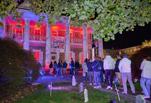 photo of University House lit up with Halloween lights as part of Haunted Valley 2025, photo by Penn State Alumni Association