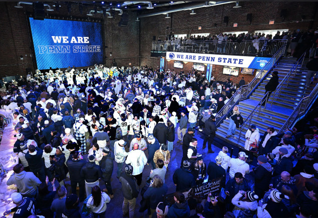 pep rally group photo at a bar near Yankee Stadium before the Pinstripe Bowl, by Penn State Alumni Association