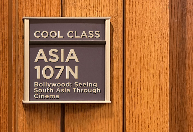 blue classroom sign that reads ASIA 107N