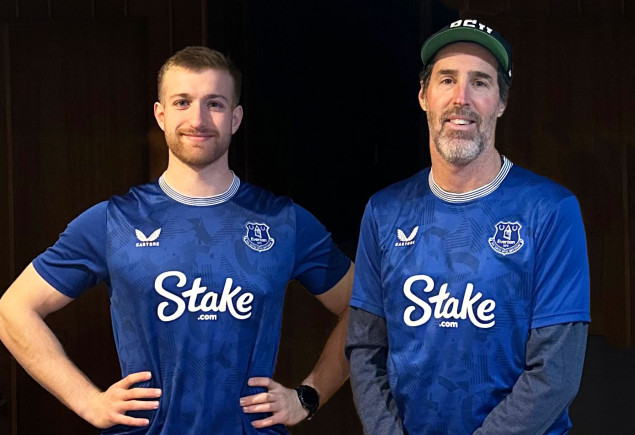 two men wearing blue Stake jerseys, courtesy