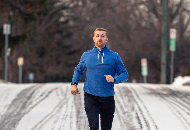 Hollingham running on a snowy road by Nick Sloff '92 A&A