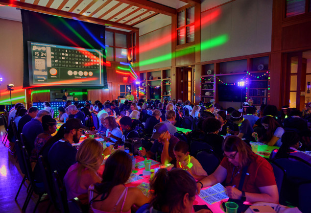 photo of We Are Weekend 2026 attendees playing glow-in-the-dark bingo in Robb Hall at Hintz, by Steve Tressler