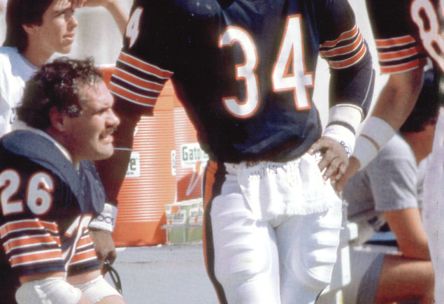 photo of Payton in uniform on sideline via Getty Images