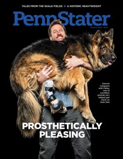 Man holding large dog with prosthetic leg