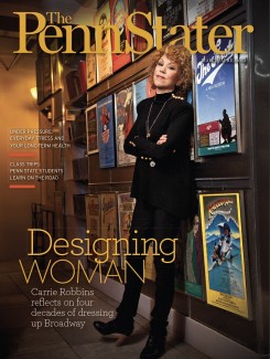 March April 2013 cover of Penn Stater Magazine_Carrie Robbins leaning against Broadway posters