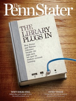 Jan/Feb 14 cover of Penn Stater Magazine_wooden desk surface with book that reads The Library Plugs In and a blue cord plugged into the front