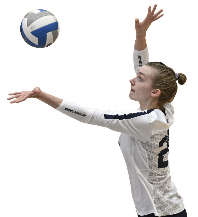 Allie Holland serving a volleyball