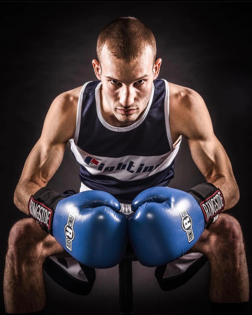 Brett Rosoff-Verbit wearing boxing gloves by Penn State boxing