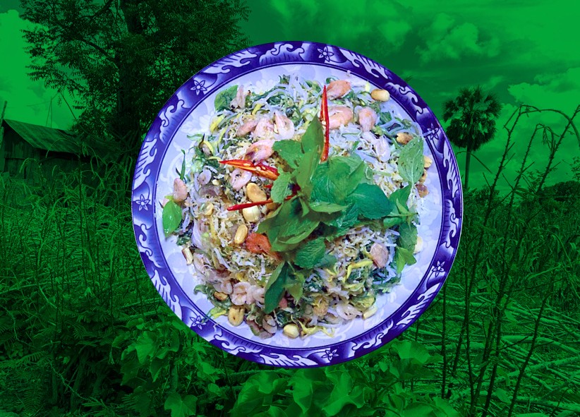 closeup of a shrimp and rice dish on blue and white plate with green-washed background photo of woods, courtesy