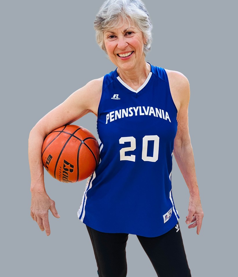 Photo of Paula Franetti in uniform with basketball, courtesy