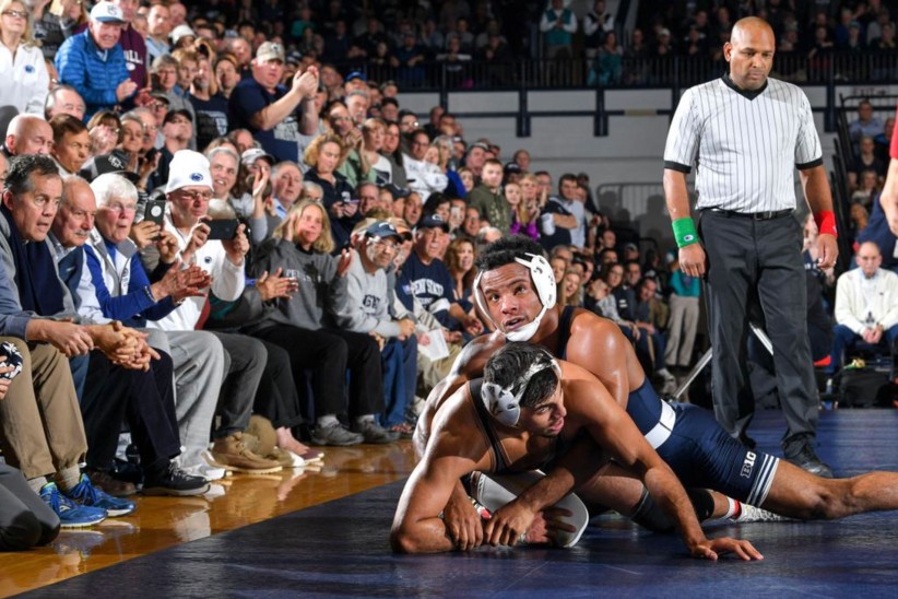 photo of a Penn State wrestler pinning an opponent at a wrestling match at Rec Hall by Mark Selders