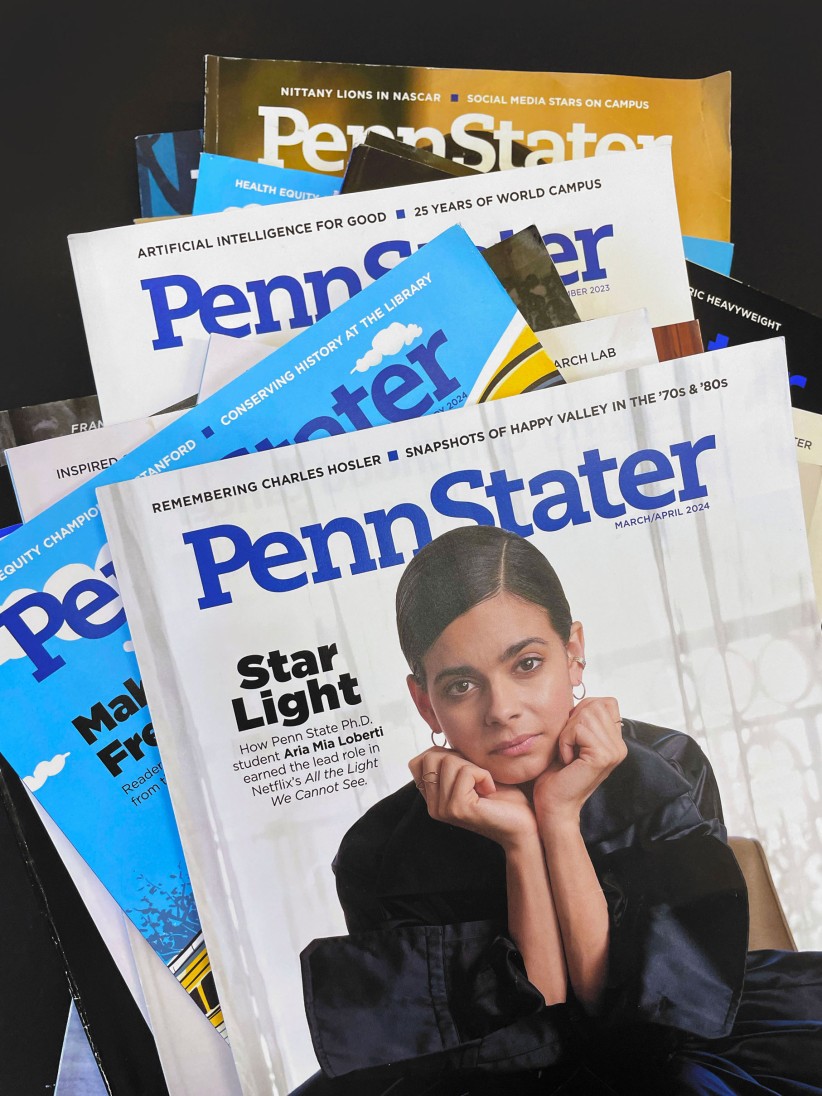 a stack of Penn Stater Magazine issues