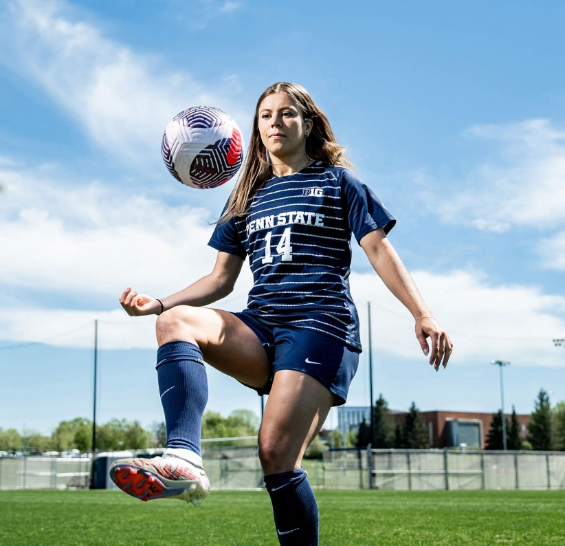 photo of Kaitlyn MacBean on soccer pitch with ball by Cardoni