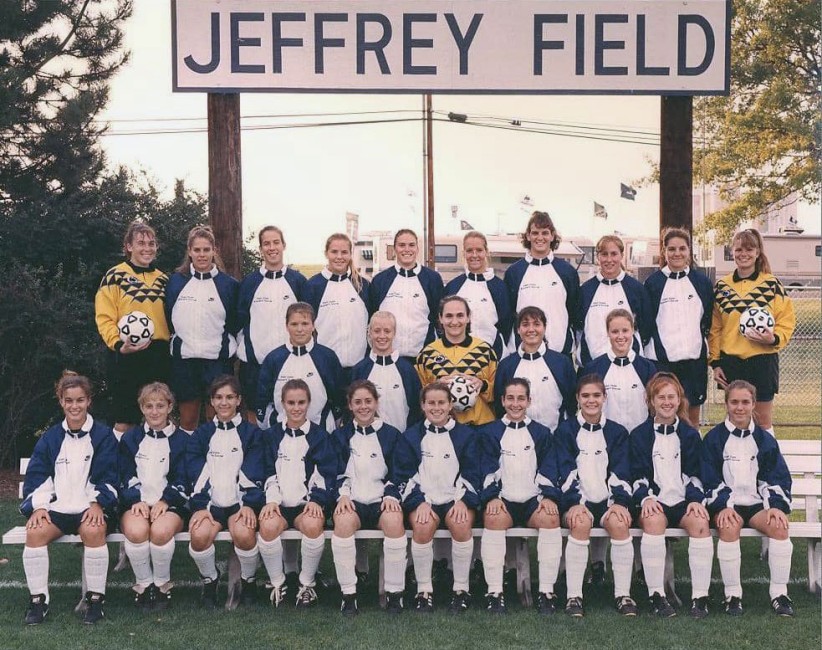 1994 women's soccer team during their first season, seated under Jeffrey Field sign, by Penn State All-Sports Museum