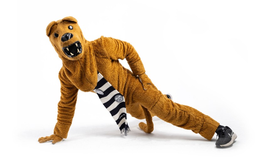 Nittany Lion mascot doing a one-armed pushup